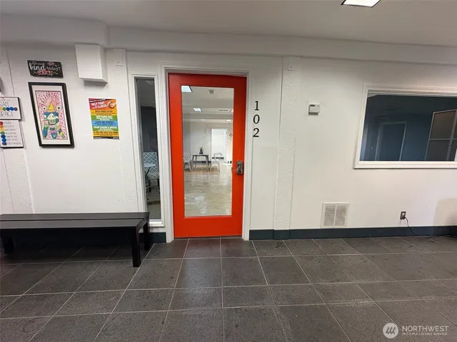 a bathroom with a shower and a sink