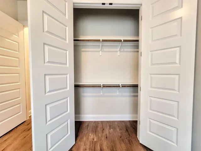 a view of an empty walk in closet