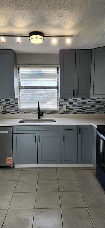 5507 Riddle Road Holiday, FL 34690 - Photo 17 of 20 a kitchen with a sink and cabinets