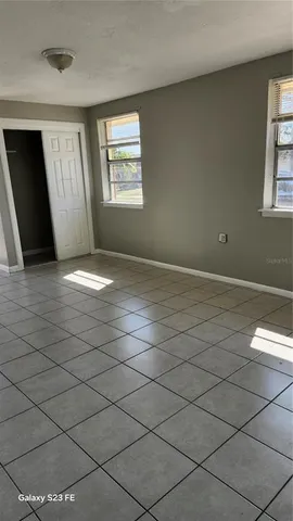 a view of an empty room with a window