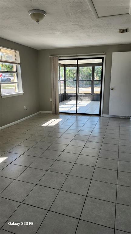 5507 Riddle Road Holiday, FL 34690 - Photo 6 of 20 a view of an empty room with a window
