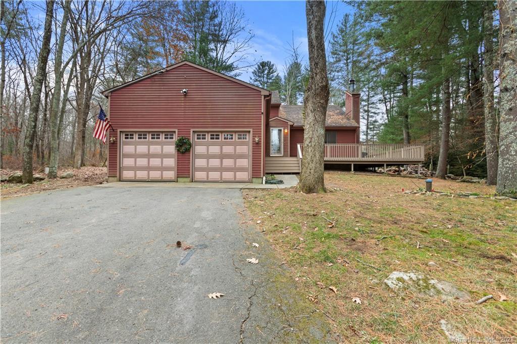 91 Northam Road Hebron, CT 06231 - Photo 1 of 1 a front view of a house with a yard and garage