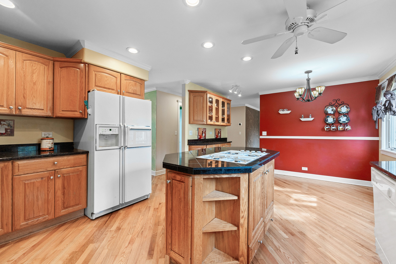 23W620 Walnut Street Roselle, IL 60172 - Photo 13 of 71 a kitchen with stainless steel appliances granite countertop a stove a refrigerator and a stove with wooden floors