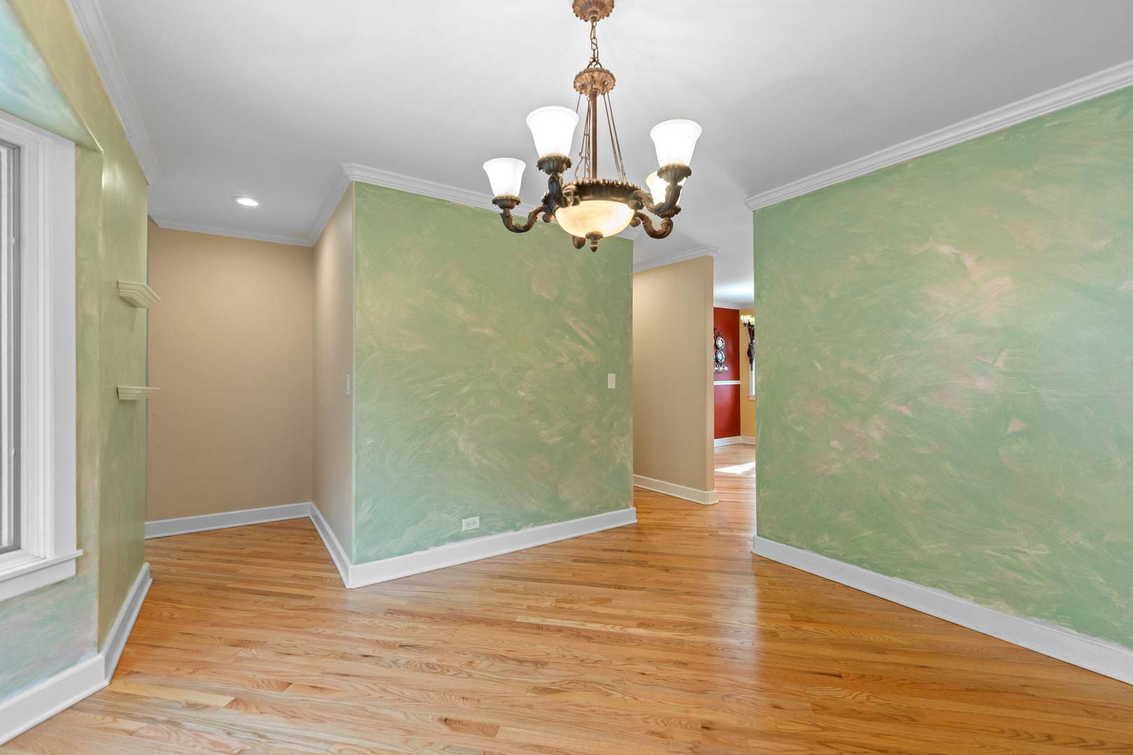 23W620 Walnut Street Roselle, IL 60172 - Photo 16 of 71 a view of a room with wooden floor and chandelier