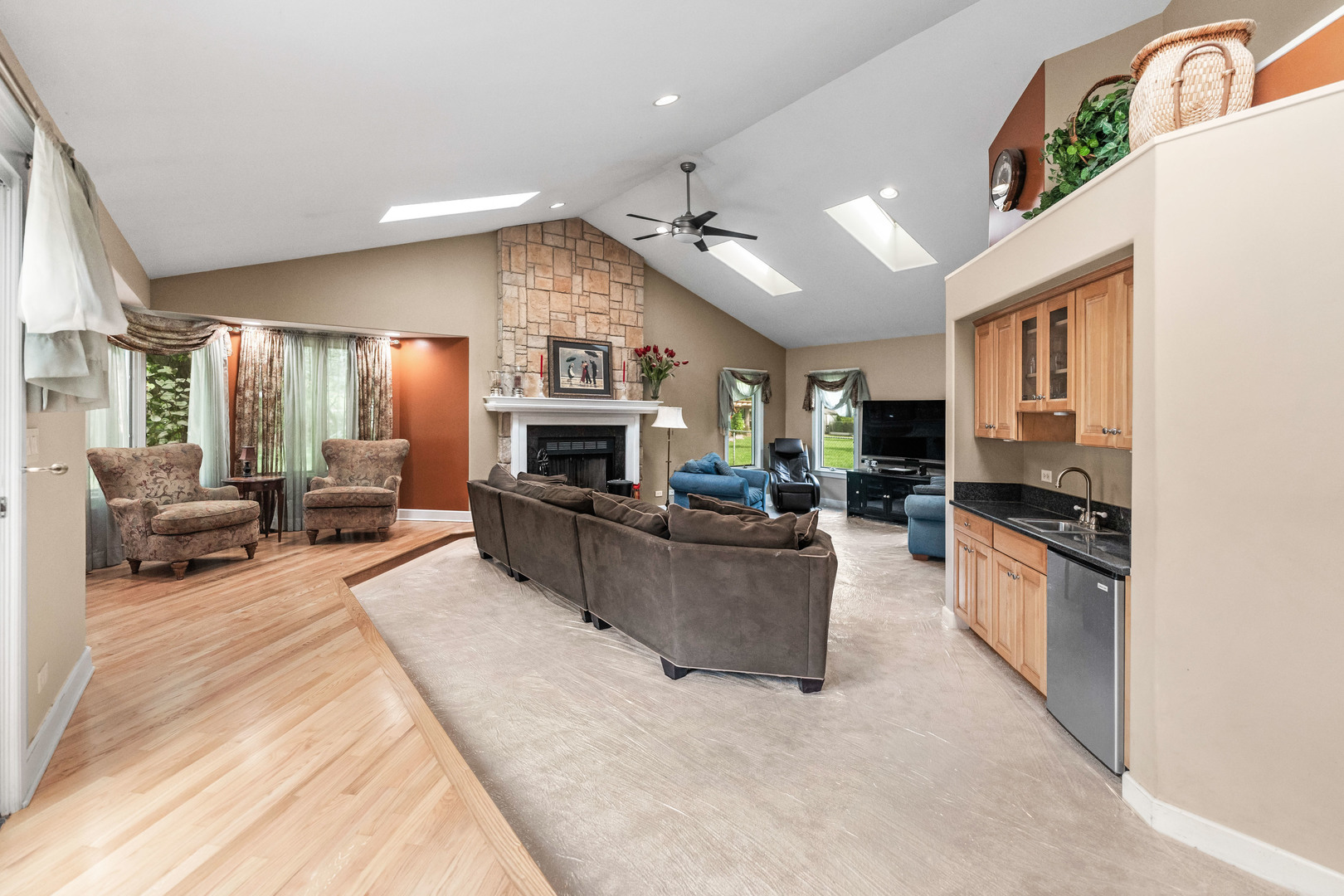 23W620 Walnut Street Roselle, IL 60172 - Photo 17 of 71 a large living room with stainless steel appliances furniture a rug and a view of kitchen