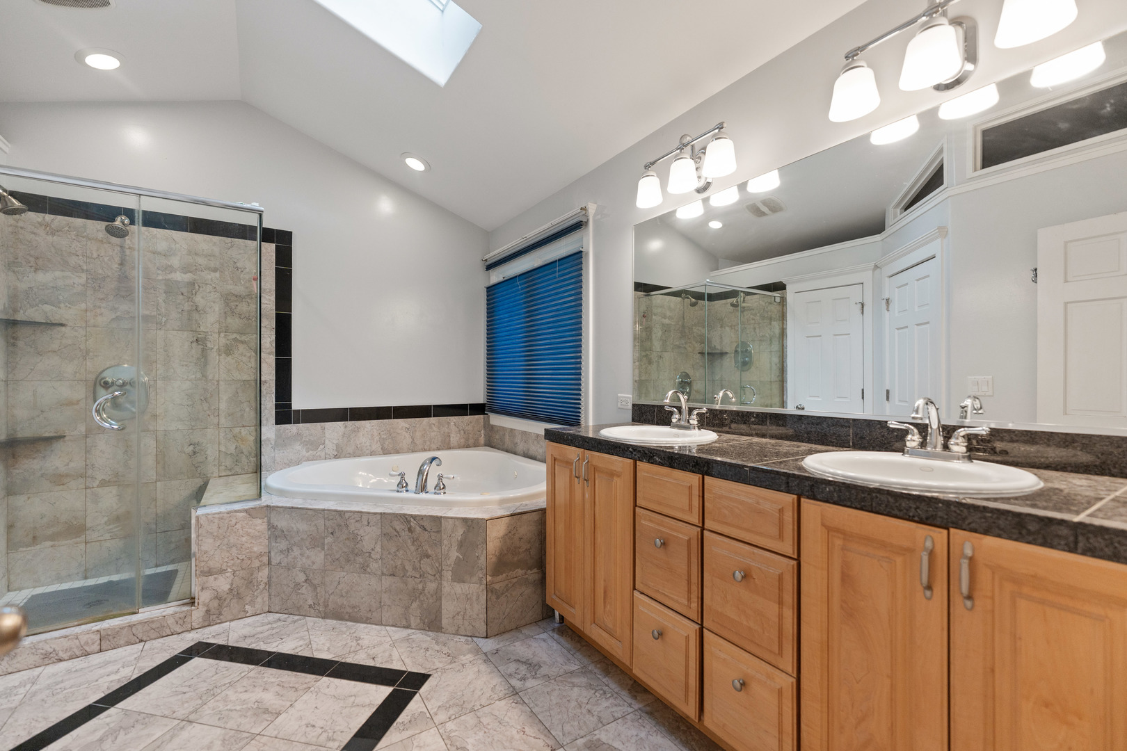 23W620 Walnut Street Roselle, IL 60172 - Photo 26 of 71 a bathroom with a double vanity sink mirror and bathtub