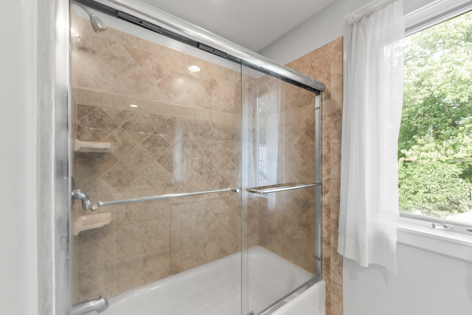23W620 Walnut Street Roselle, IL 60172 - Photo 27 of 71 a bathroom with a glass shower door