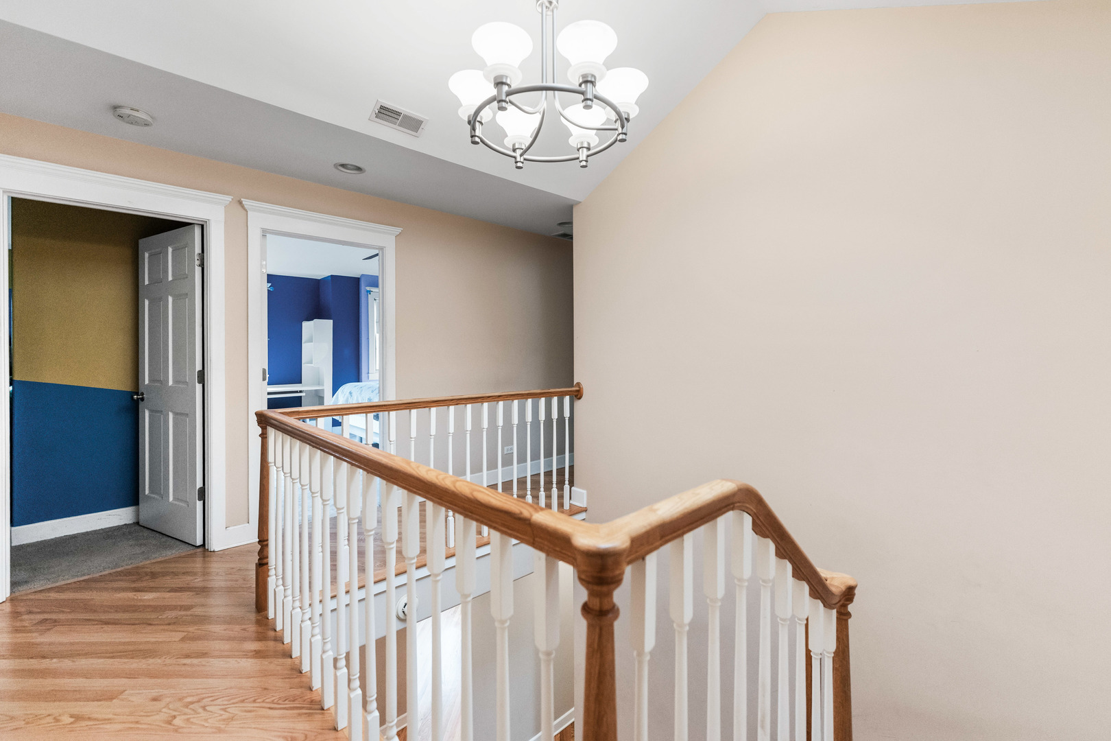 23W620 Walnut Street Roselle, IL 60172 - Photo 30 of 71 a view of staircase with railing and a chandelier