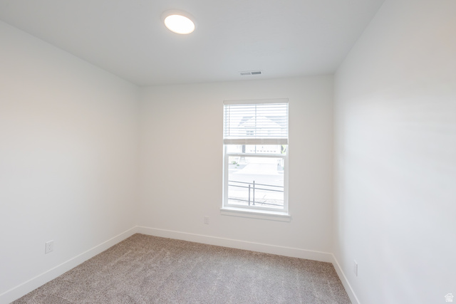 693 West 4500th South, Unit O101 Mapleton, UT 84664 - Photo 5 of 16 Unfurnished room featuring light colored carpet and baseboards