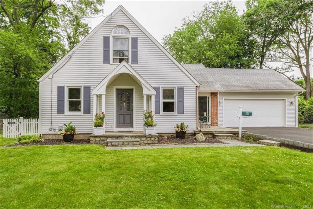 10 Beauford Road Norwalk, CT 06854 - Photo 1 of 1 a front view of house with yard outdoor seating and yard