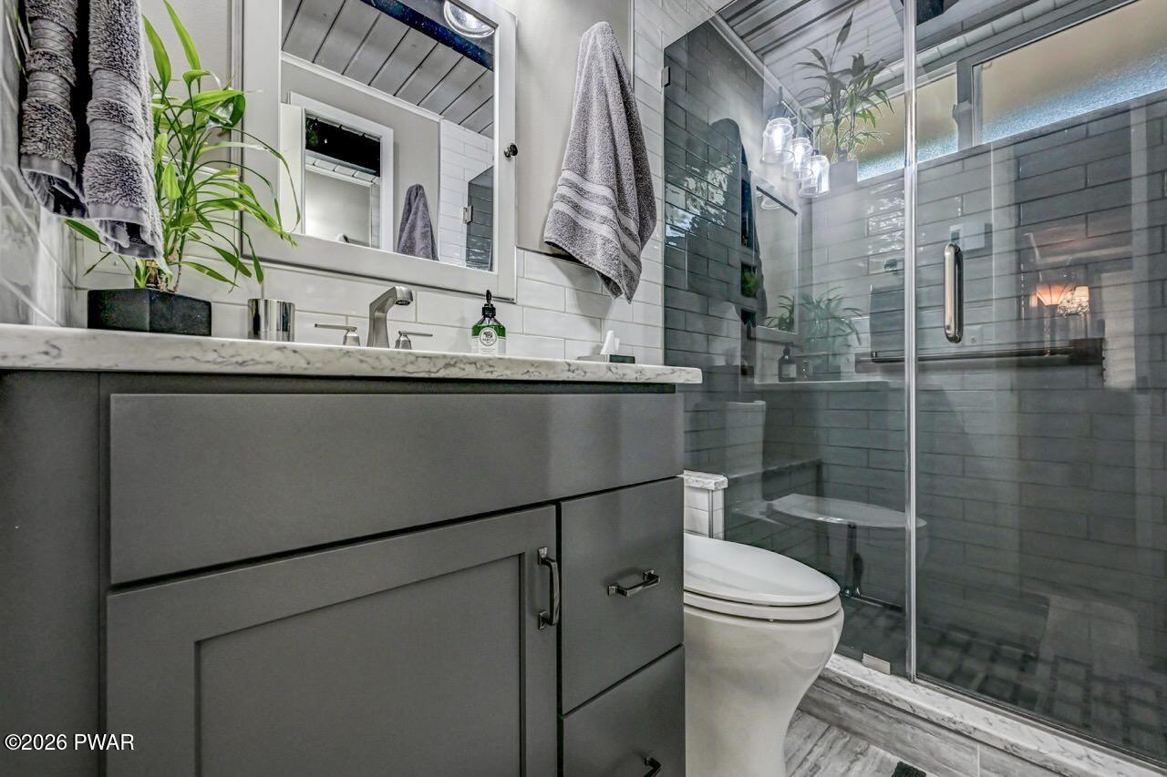 103 Forest Drive Hawley, PA 18428 - Photo 45 of 85 a bathroom with a sink a toilet and shower