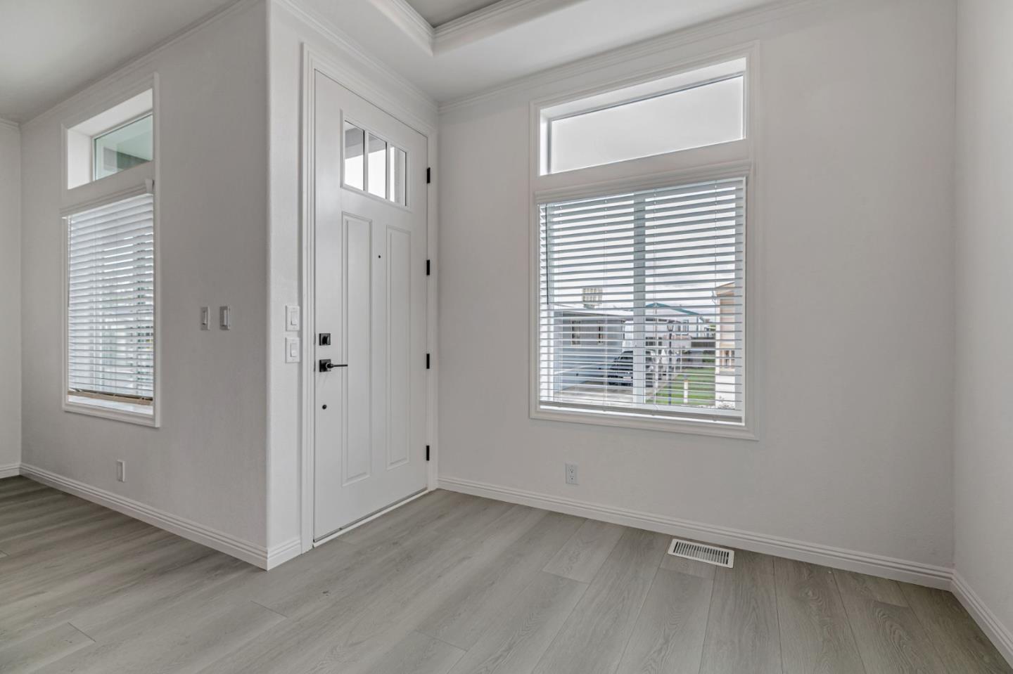 555 Umbarger Road, Unit 131 San Jose, CA 95111 - Photo 6 of 32 an empty room with wooden floor and windows