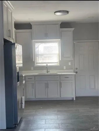 a view of a livingroom with a ceiling fan and window
