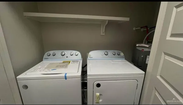 an empty room with a chandeliers fan