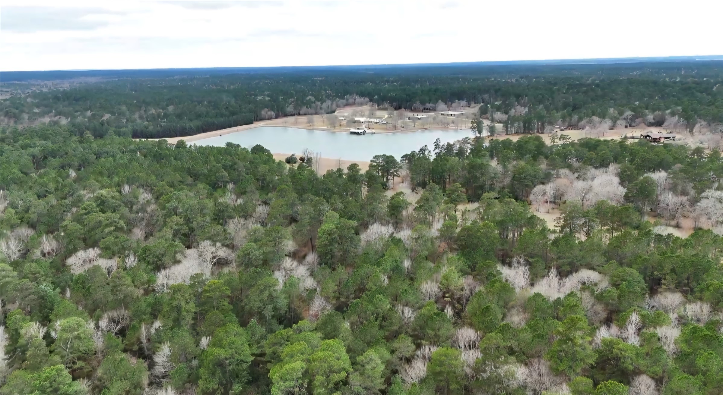 0 Radius Road Huntsville, TX 77340 - Photo 5 of 9 a view of a lake from a yard