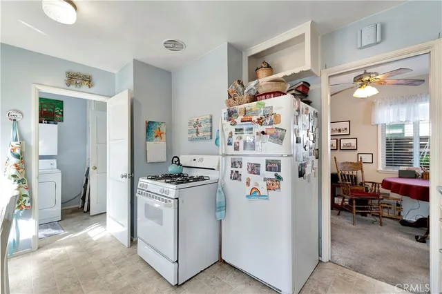 a kitchen with cabinets and window