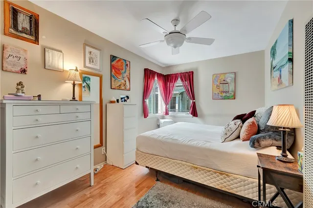 a living room with furniture and a book shelf