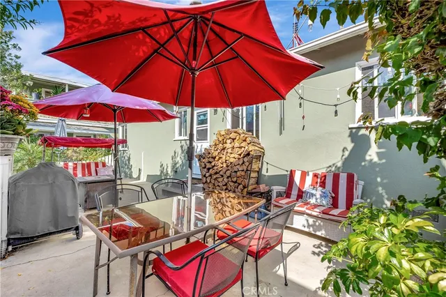 an outdoor space with patio and umbrella