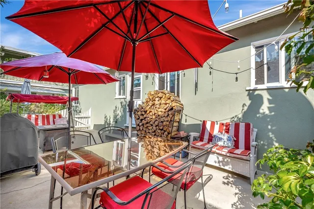 a view of a backyard with chairs