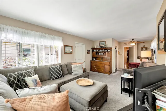 a living room with furniture and a table