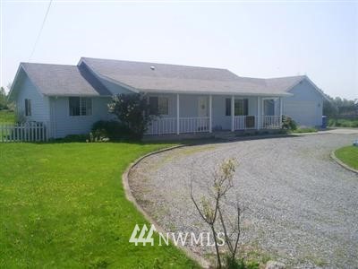 28910 Hinkleman Road Buckley, WA 98321 - Photo 1 of 1 a front view of a house with a yard and garage