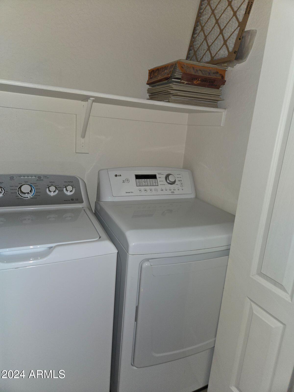 17365 North Cave Creek Road, Unit 114 Phoenix, AZ 85032 - Photo 10 of 18 a utility room with dryer and washer