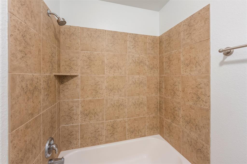 500 Braewick Drive Fort Worth, TX 76131 - Photo 29 of 35 a bathroom with a shower