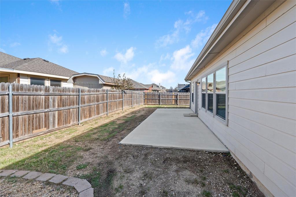 500 Braewick Drive Fort Worth, TX 76131 - Photo 33 of 35 a view of a backyard with a deck