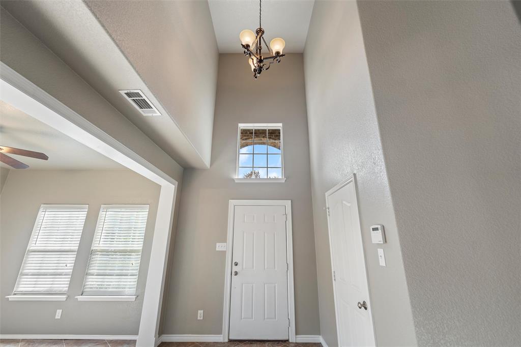 500 Braewick Drive Fort Worth, TX 76131 - Photo 7 of 35 a view of a hallway with windows