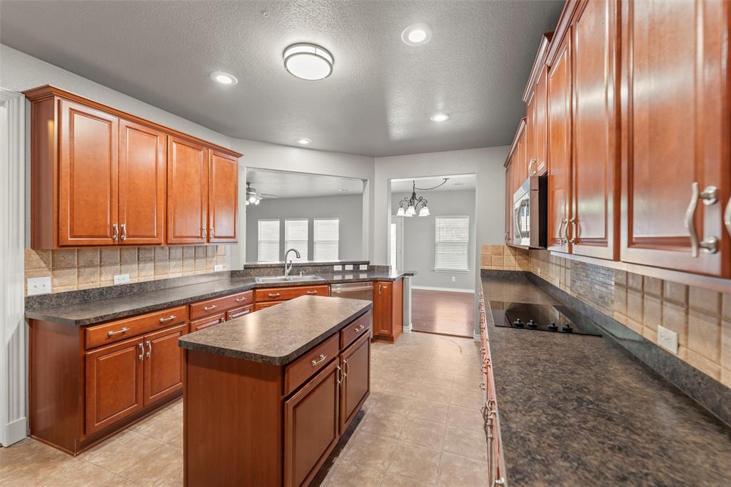 500 Braewick Drive Fort Worth, TX 76131 - Photo 10 of 35 a kitchen with large windows and living room