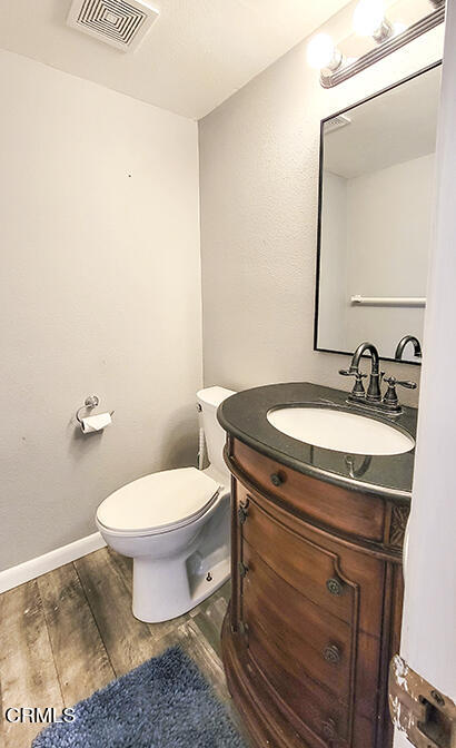 4905 Catamaran Street Oxnard, CA 93035 - Photo 7 of 14 a bathroom with a sink and a toilet
