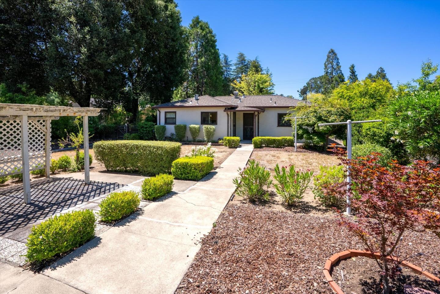 16899 Kennedy Road Los Gatos, CA 95032 - Photo 35 of 61 a front view of a house with a yard