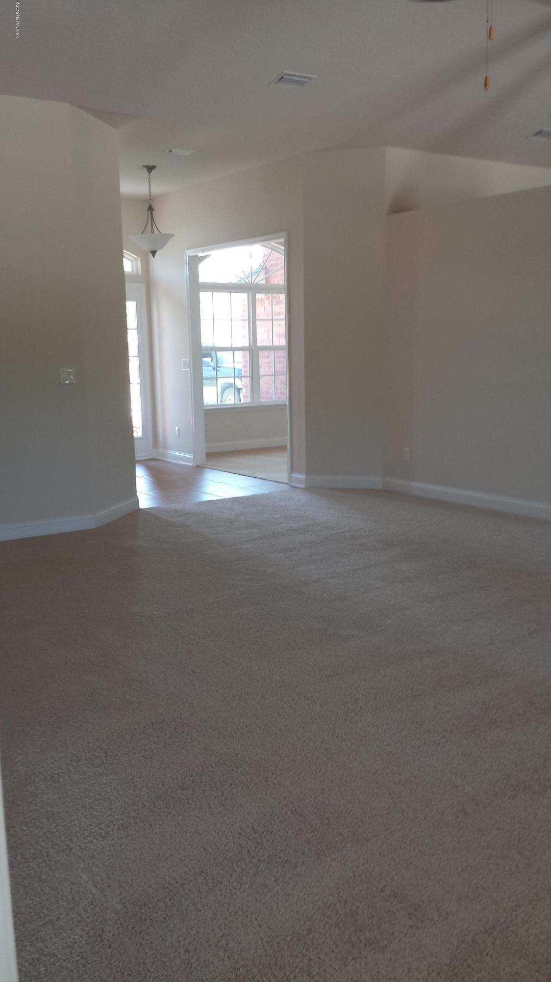3016 Longleaf Ranch Circle Middleburg, FL 32068 - Photo 3 of 18 2169 family room