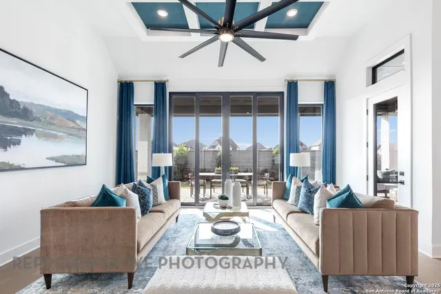 a living room with furniture and a large window