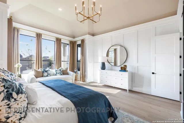 a spacious bedroom with a large bed and a large window