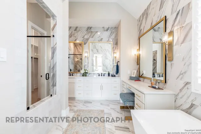 a bathroom with a tub sink vanity and a mirror