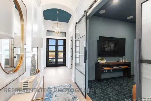 a living room with furniture and a rug