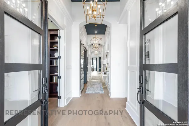 a view of living room with furniture and chandelier