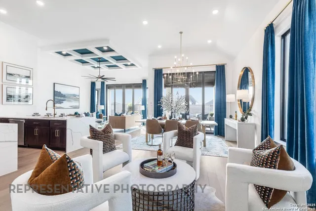 a living room with furniture potted plant and a large window