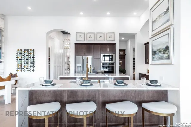 a kitchen with a dining table and chairs