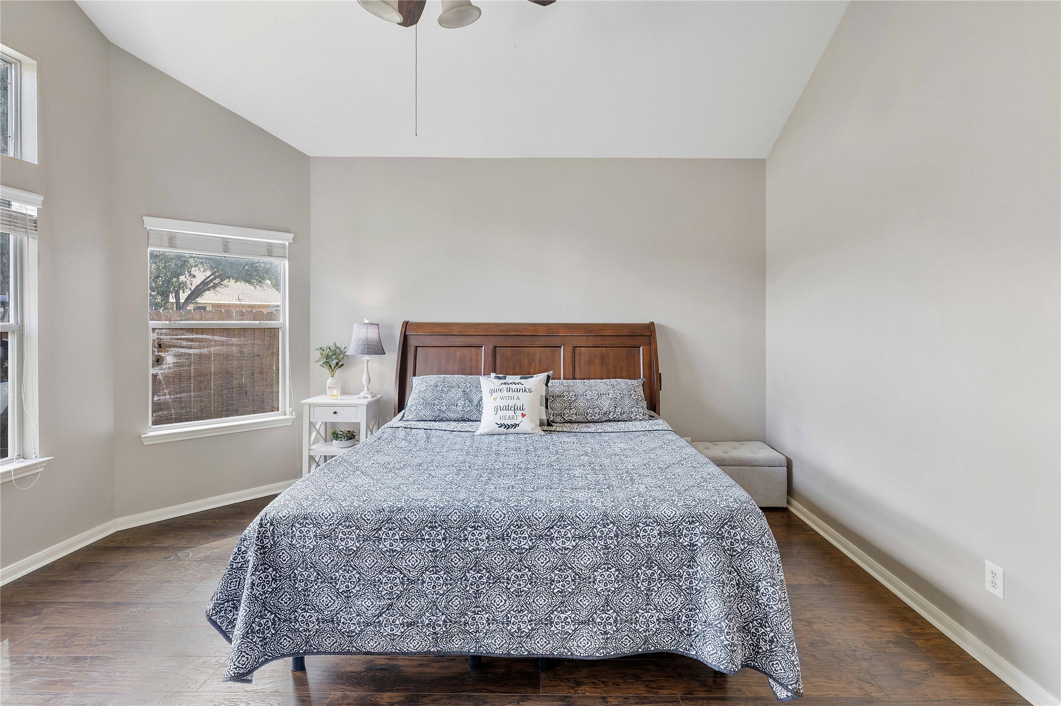 24506 Fort Path Drive Spring, TX 77373 - Photo 20 of 46 Spacious bedroom with high ceilings, abundant natural light, and a cozy wooden bed frame.