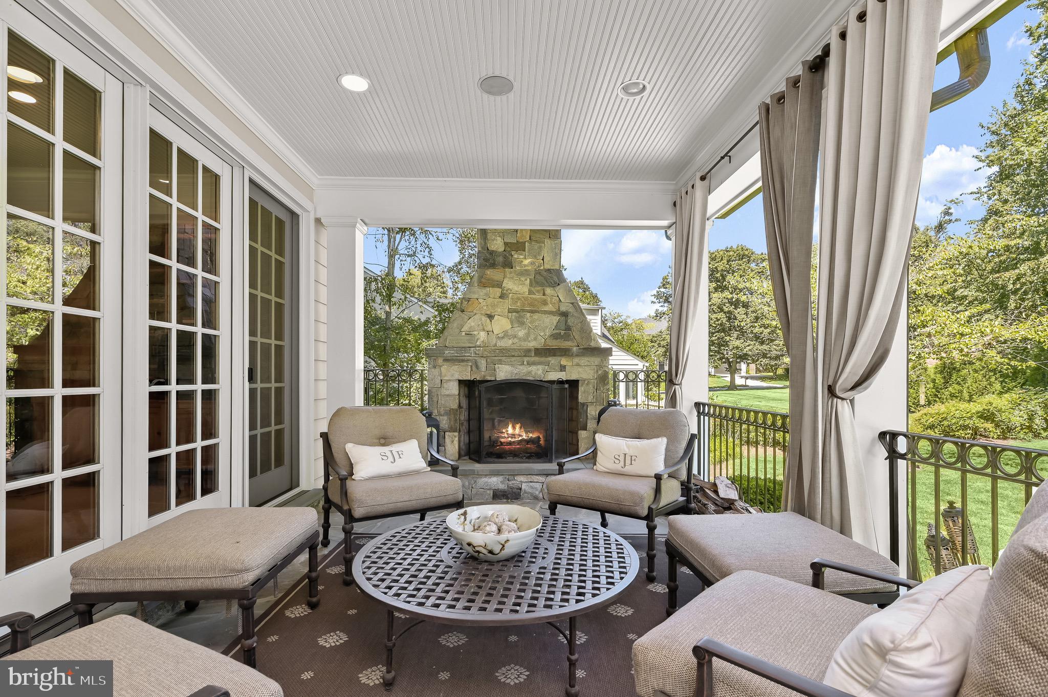 6939 Greentree Road Bethesda, MD 20817 - Photo 41 of 54 Covered Patio with Fireplace