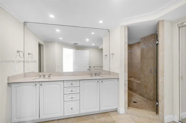 a bathroom with a granite countertop sink mirror and double