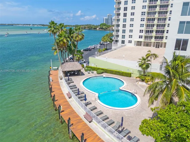 a aerial view of a swimming pool and outdoor seating