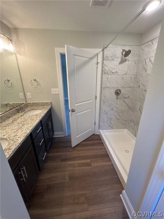 3839 Three Chopt Road Gum Spring, VA 23065 - Photo 12 of 15 a bathroom with a granite countertop sink a mirror and shower