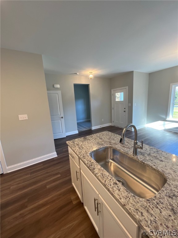3839 Three Chopt Road Gum Spring, VA 23065 - Photo 8 of 15 a kitchen with kitchen island a sink and wooden floor