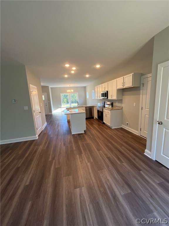 3839 Three Chopt Road Gum Spring, VA 23065 - Photo 10 of 15 a living room with stainless steel appliances furniture a refrigerator and wooden floor