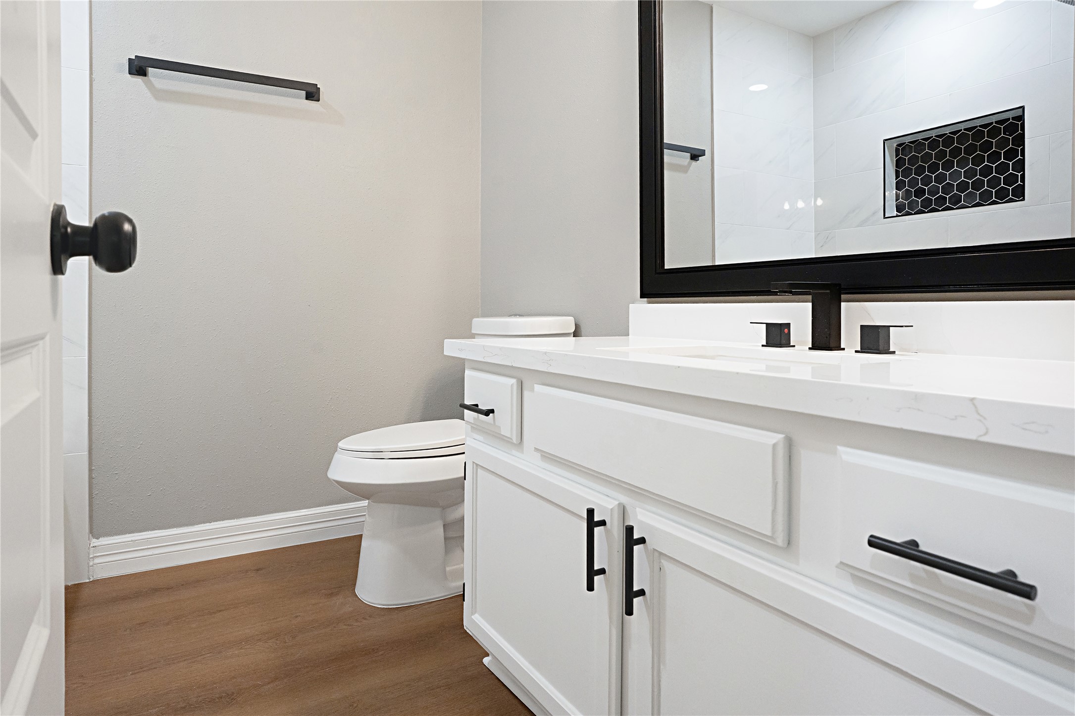 3 Still Corner Place Spring, TX 77381 - Photo 31 of 42 Updated secondary bathroom featuring a white quartz vanity, modern fixtures, and stylish cabinetry with ample storage.
