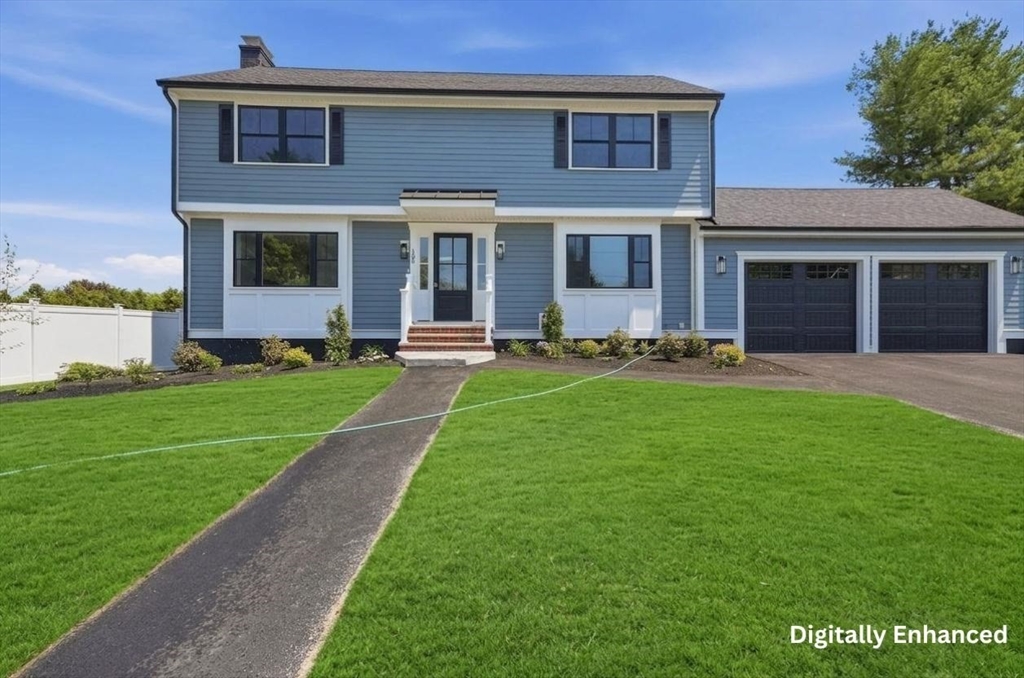 105 Stafford Road Lowell, MA 01852 - Photo 40 of 42 a front view of a house with a yard and trees