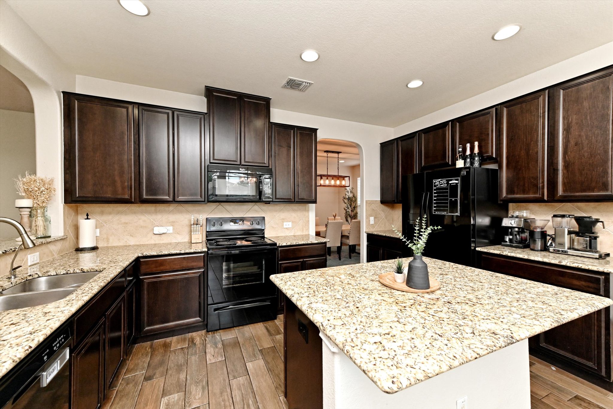 210 Animas Drive Georgetown, TX 78626 - Photo 11 of 31 a kitchen with granite countertop stainless steel appliances and sink